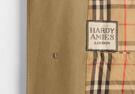 Detail of the personalised label in British fashion designer Hardy Amies’s Burberry car coat. 1979