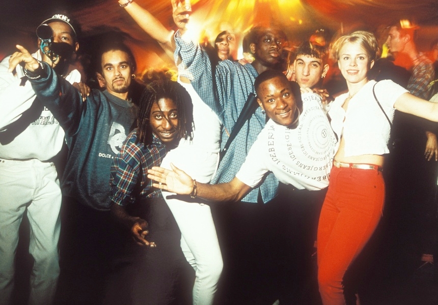© Tristan O'Neill / Museum of Youth Culture. Clubbers pose for the camera, rave at Bagleys, London, 1996